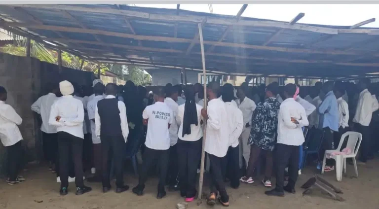 NSCDC operatives with rescued students after uncovering a suspected fake university operating from a residential apartment in Badagry, Lagos.