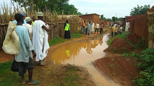 Flood and storm damage in Bichi, Kano State, after a rainstorm killed eight people and destroyed homes, prompting calls for emergency relief.