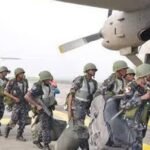 Nigerian Air Force C-130H aircraft airlifting troops for ECOWAS peacekeeping mission to The Gambia.