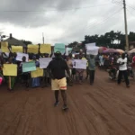 Ebenesi community residents in Nnobi, Anambra State, protesting against the planned demolition of homes for a power line project.