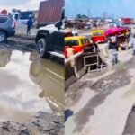 Motorists stuck in gridlock on the Benin-Asaba Expressway amid worsening road conditions.