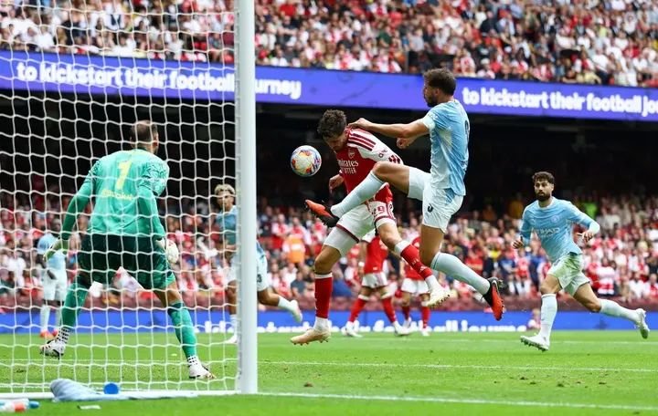 Arsenal players celebrate their 3-0 Community Shield victory over Manchester City at the Principality Stadium.