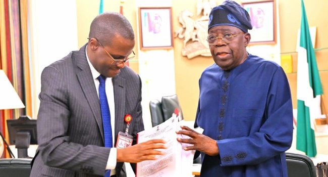 ICPC Chairman Musa Aliyu presents the interim PFIPC investigation report to President Bola Tinubu at the Presidential Villa in Abuja.