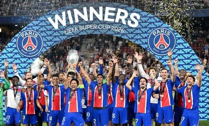 PSG players celebrate after beating Aston Villa to retain the UEFA Super Cup. PSG's Marquinhos lifts the trophy with teammates after winning the UEFA Super Cup REUTERS/Angelika Warmuth