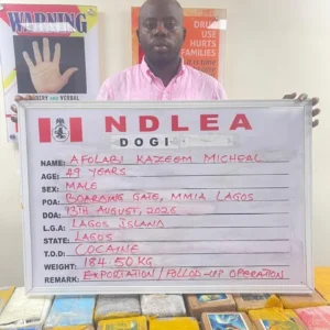 NDLEA officials and seized items linked to the arrest of alleged cocaine trafficking suspect KC Luxury.