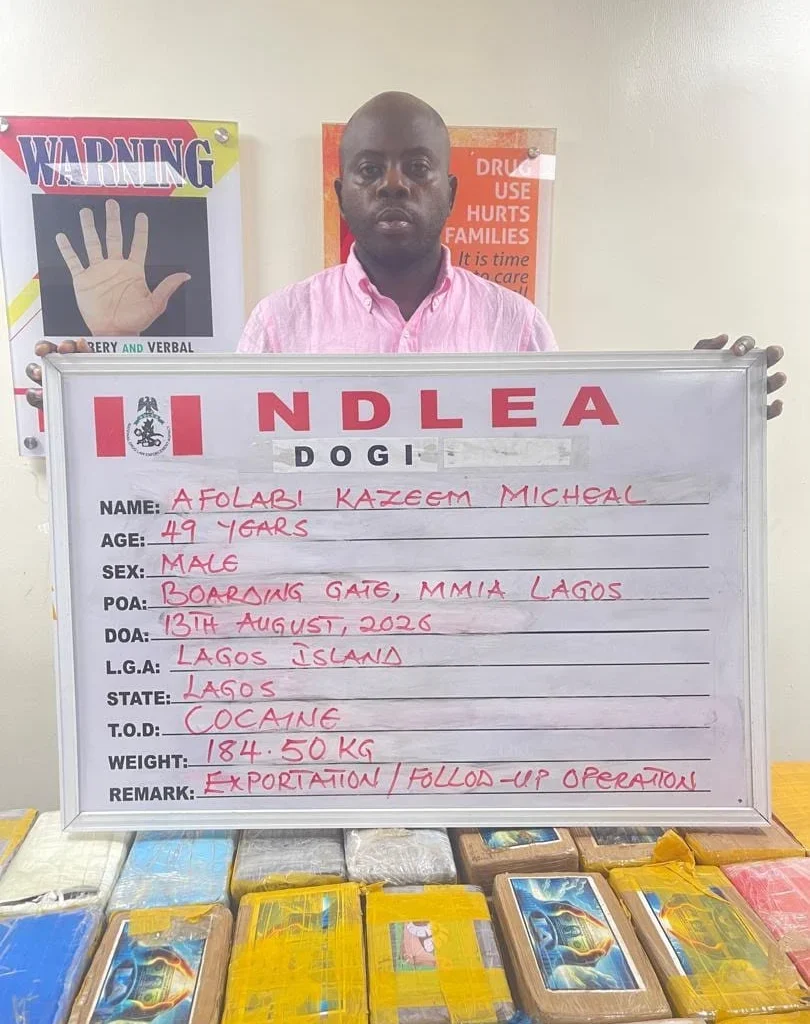NDLEA officials and seized items linked to the arrest of alleged cocaine trafficking suspect KC Luxury.