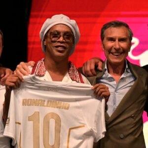 Ronaldinho holds a Ravenna FC jersey during the Italian club's team presentation in Marina di Ravenna.