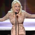 Dolly Parton performing onstage during a 2017 awards ceremony in Los Angeles.