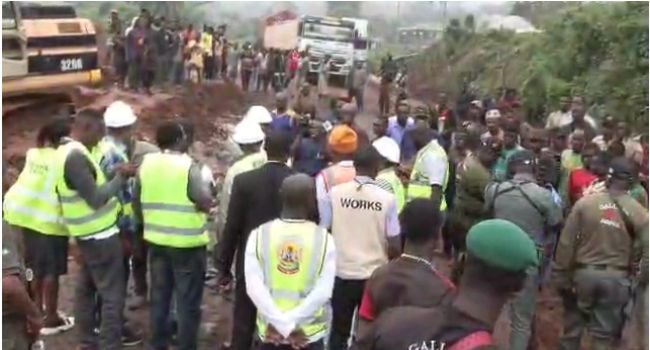 Workers commence repairs on the dilapidated Ifaki-Oye-Ilupeju Road in Ekiti State as stranded trailers wait along the route.