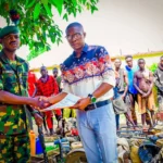 Nigerian Army and NSCDC Mining Marshals officials during the handover of 18 suspected illegal miners arrested in Niger State.