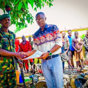 Nigerian Army and NSCDC Mining Marshals officials during the handover of 18 suspected illegal miners arrested in Niger State.