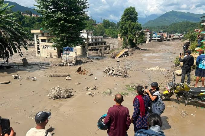 Rescue workers search flood-hit areas in Nepal after deadly flash floods on the Nepal-Tibet border.