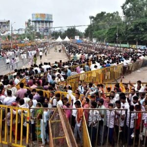 Indian Hindu devotees gather at a temple during the holy Shravan month.