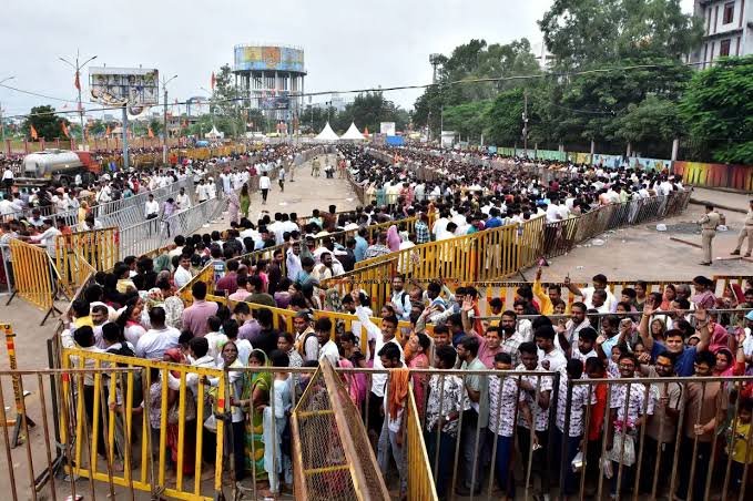 Indian Hindu devotees gather at a temple during the holy Shravan month.