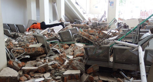 Rescuers search through rubble after a 7.7-magnitude earthquake struck Maumere on Indonesia’s Flores Island.