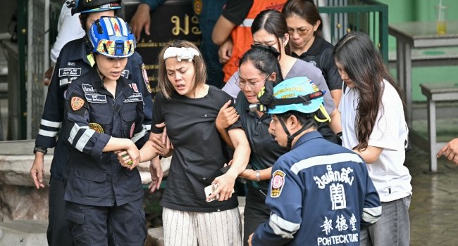 Police and emergency responders outside Debsirin Nonthaburi School after a deadly school shooting in Nonthaburi province, Thailand.