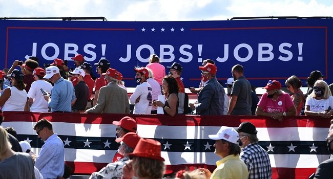 Donald Trump supporters at a campaign event as the latest US jobs report shows the American economy lost 23,000 jobs in July ahead of the midterm elections.