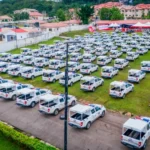 Ekiti Governor Biodun Oyebanji presenting 100 operational vehicles to security agencies in the state.