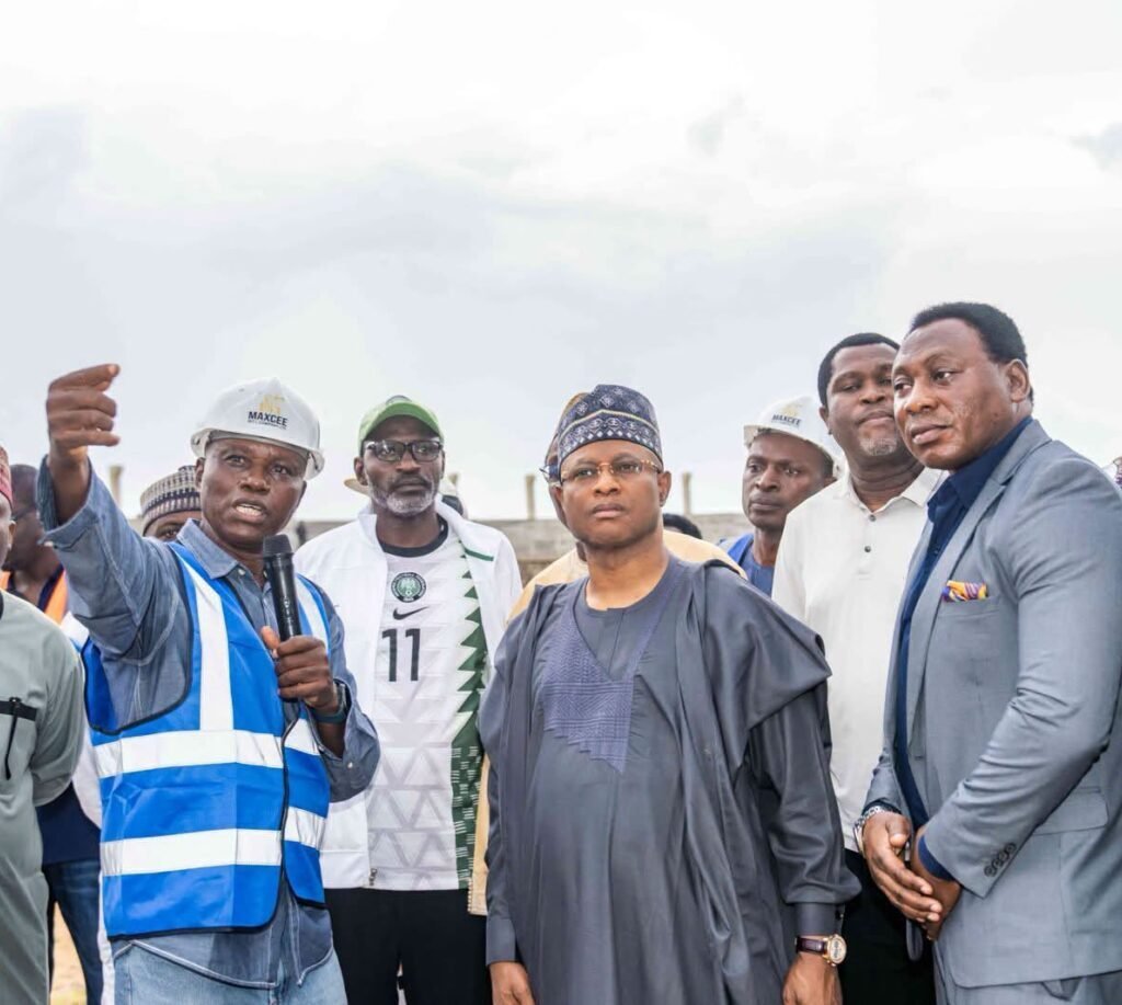 Uba Sani with Daniel Amokachi and Emmanuel Babayaro during a visit to Ahmadu Bello Stadium in Kaduna.