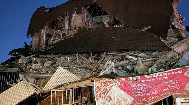 Collapsed building in Wuse Zone 4, Abuja, as emergency responders conduct search and rescue operations.