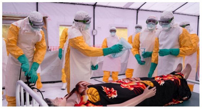 Health workers in protective equipment during Ebola response training in the Democratic Republic of Congo.