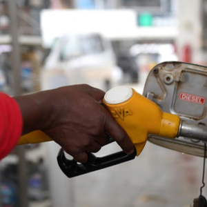Petrol pump nozzle showing fuel price concerns amid Nigeria's rising petrol costs
