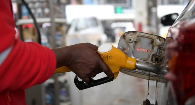 Petrol pump nozzle showing fuel price concerns amid Nigeria's rising petrol costs