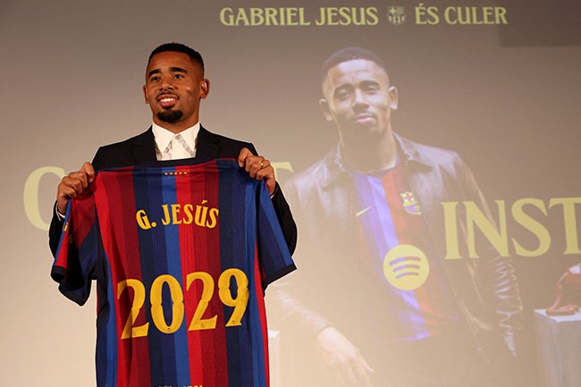 Gabriel Jesus poses with his Barcelona jersey during his official presentation in Barcelona.