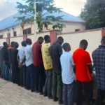 Suspended Niger State NSCDC Commandant Suberu Aniviye and other officers paraded over the deaths of 37 suspected illegal miners