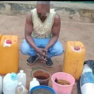 Police officers display suspects arrested over the suspected contaminated alcoholic drinks linked to deaths in Odigbo, Ondo State.