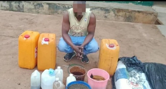 Police officers display suspects arrested over the suspected contaminated alcoholic drinks linked to deaths in Odigbo, Ondo State.