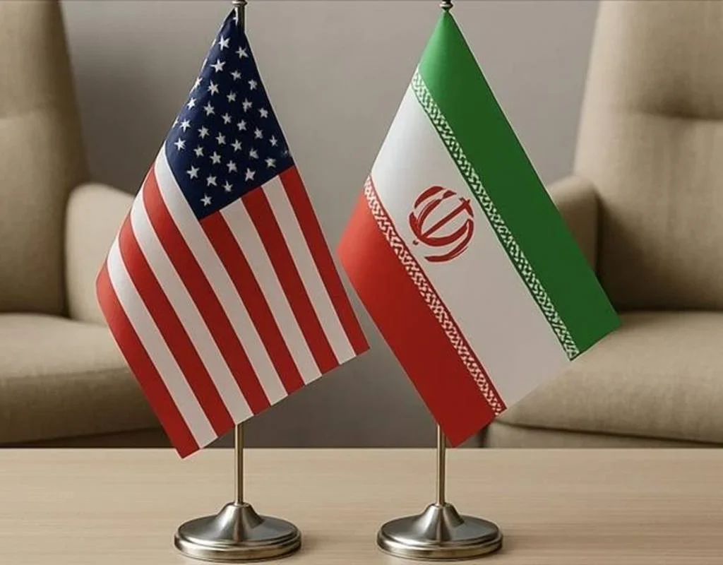 Iran and US flags representing escalating tensions over the Strait of Hormuz.