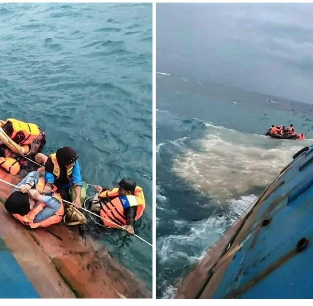 Overturned Indonesian ferry floating in rough waters during a search-and-rescue operation in the Java Sea.