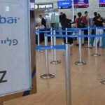 Passengers at Ben Gurion Airport following the emergency diversion of a flydubai flight after an alleged cockpit attack.