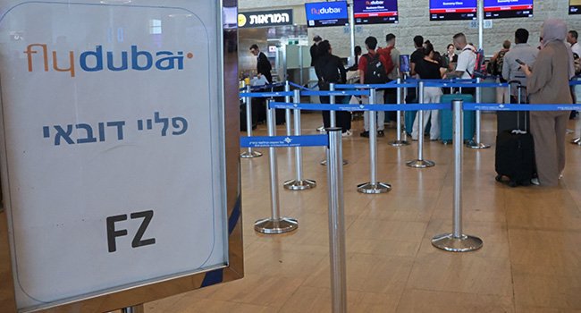 Passengers at Ben Gurion Airport following the emergency diversion of a flydubai flight after an alleged cockpit attack.