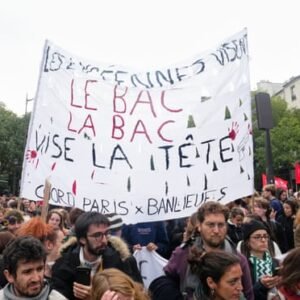 Protesters march during a demonstration in Paris, France, on October 6, 2026, amid nationwide protests over rising living costs and learning conditions.