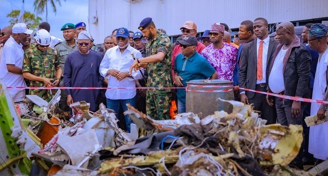 NAF aircraft crash recovery operations in Igbokoda, Ondo State, as authorities address residents' environmental and public health concerns.