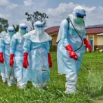 Health workers wearing protective equipment as Nigeria intensifies its response to the Ebola outbreak in Abuja.