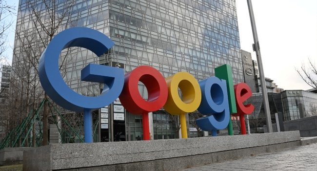 Google logo displayed outside a Google office building in Beijing, China, amid reports of a Google Cloud outage disrupting UK banks and online services.