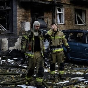 Rescuers search a damaged five-storey residential building after a Russian strike in Ukraine.