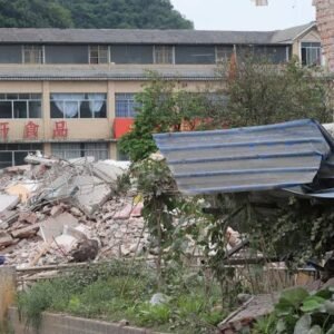 Collapsed houses and earthquake damage in China's Tibet region following a 7.0-magnitude earthquake that killed 16 people and injured 32 others.