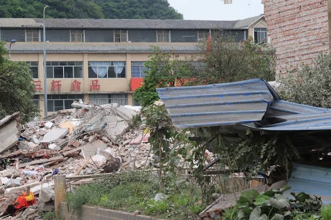 Collapsed houses and earthquake damage in China's Tibet region following a 7.0-magnitude earthquake that killed 16 people and injured 32 others.