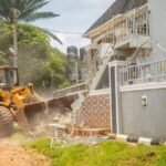 Edo State security officials demolish a building in Uromi allegedly linked to suspected ritual activities during a crackdown on crime.