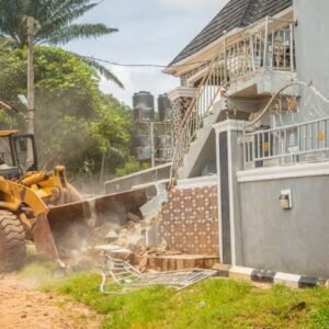 Edo State security officials demolish a building in Uromi allegedly linked to suspected ritual activities during a crackdown on crime.