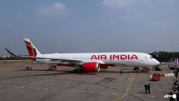 Air India passenger aircraft at an airport following a security alert and diversion to Jaipur over a reported hijacking rumour.