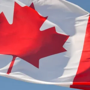 Canadian flag representing Canada's updated citizenship by descent rules for people born outside the country.