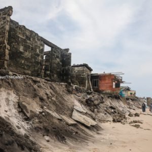 Destroyed homes and shoreline in Okun-Ajah, Lagos, after severe coastal erosion and ocean surge displaced residents.