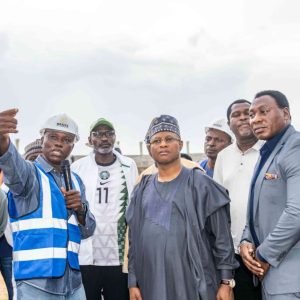 Uba Sani with Daniel Amokachi and Emmanuel Babayaro during a visit to Ahmadu Bello Stadium in Kaduna.