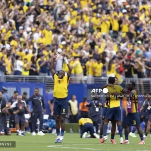 Ecuador players celebrate after defeating Germany 2-1 in their Group E match at the 2026 FIFA World Cup, securing a place in the knockout stage.
