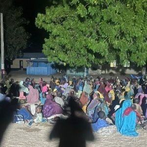 Rescued women and children receive assistance from Nigerian military personnel after being freed from a Boko Haram enclave in the Mandara Mountains, Borno State.